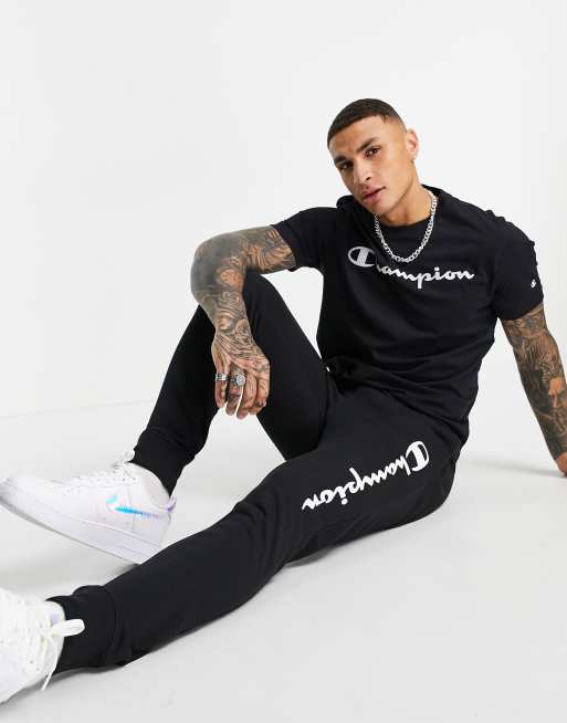 Champion large script logo joggers in black ASOS