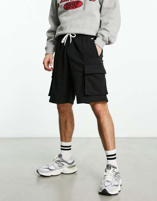 Champion Legacy Bermuda cargo shorts with logo in black | ASOS