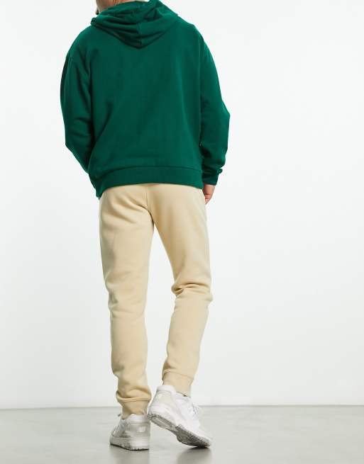 Champion Legacy joggers in beige ASOS