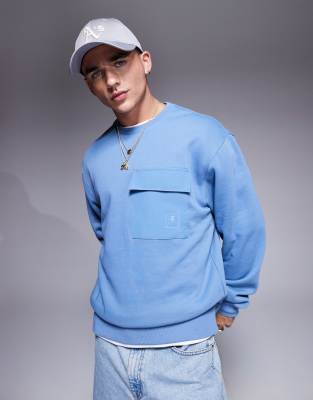 Champion Champion Legacy pocket crew neck sweatshirt in blue