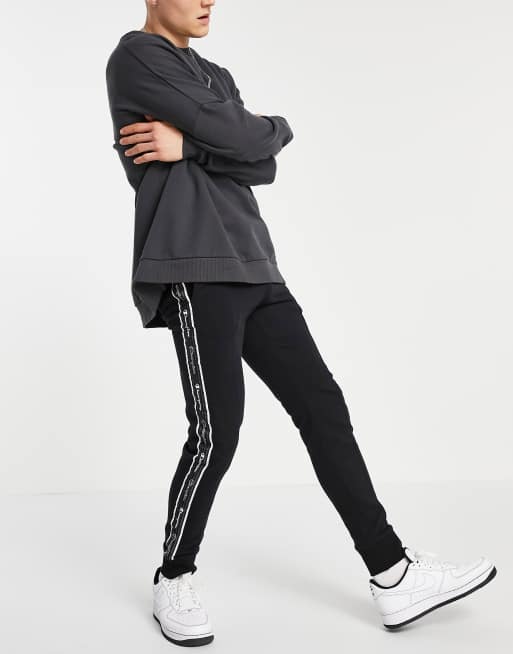 Champion logo taped track pants in black