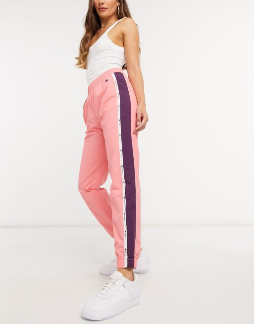 Champion logo track pants in pink ASOS