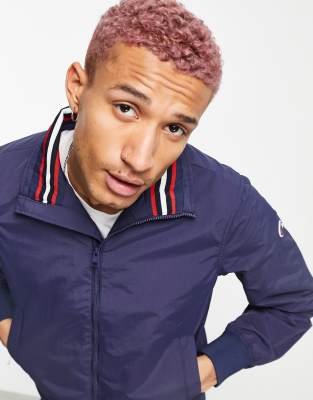 Champion logo zip up jacket in navy - ASOS Price Checker