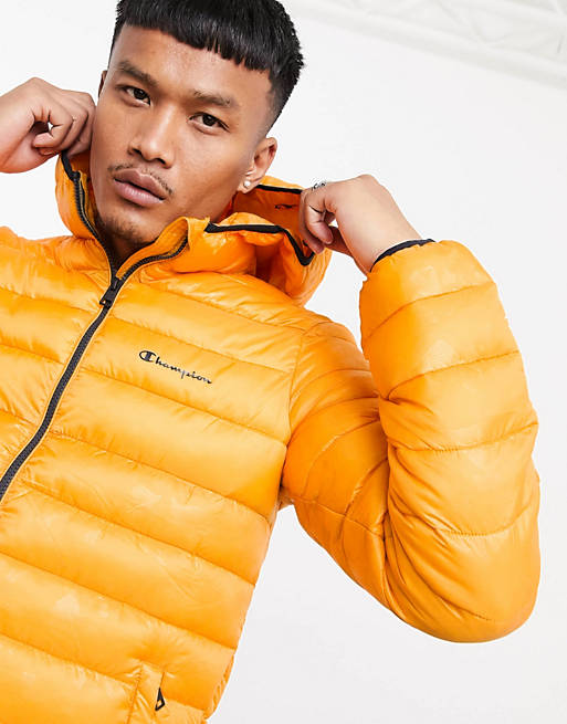 Champion padded jacket with hood in orange camo | ASOS
