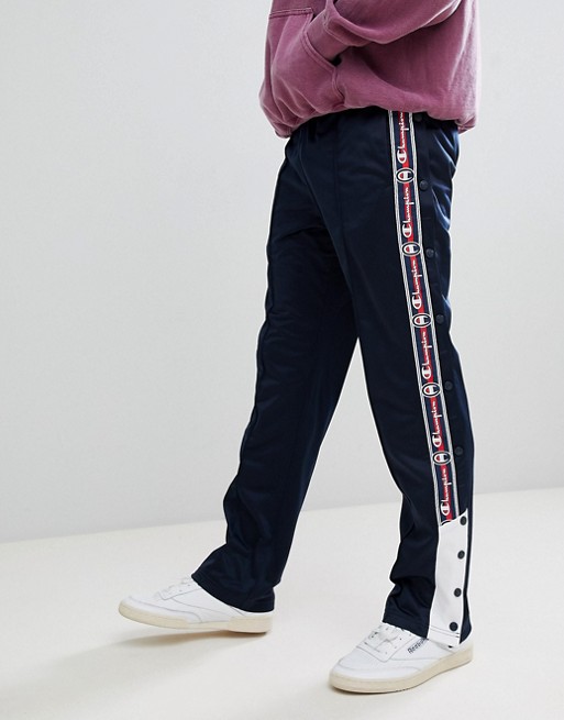 Champion popper sweatpants with taping in navy | ASOS