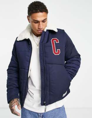 Champion puffer jacket in navy - ASOS Price Checker