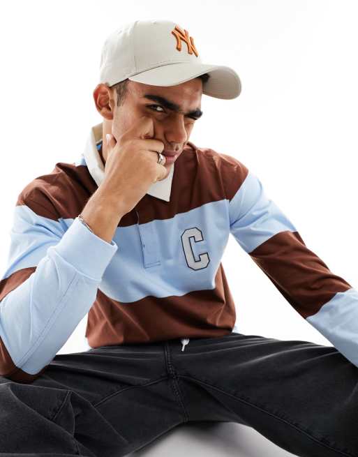 Champion - Rochester - Polo a maniche lunghe blu a righe multicolore
