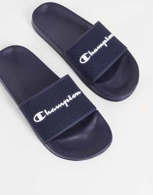 Champion slides with script logo in navy