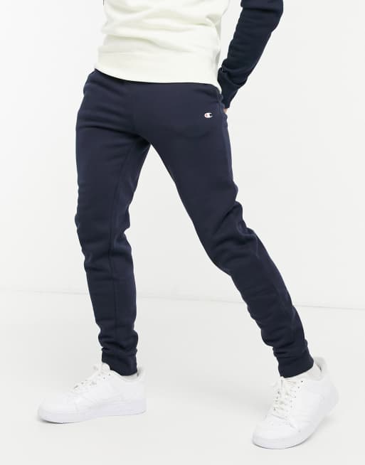 Champion small logo cuffed joggers in navy | ASOS