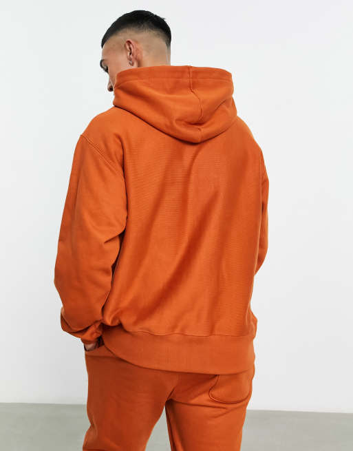 Orange champion hoodie discount with logo all over