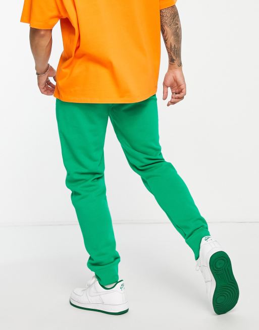 champion small logo joggers in green ASOS