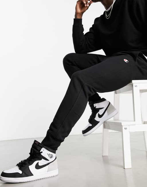 Champion small logo sweatpants in ASOS black 