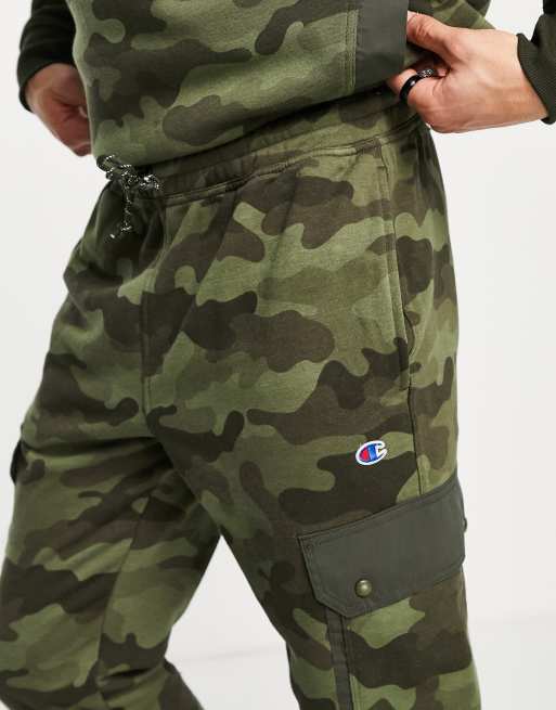 Champion small logo sweatpants in camo