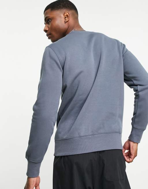 Champion small logo sweatshirt in blue ASOS