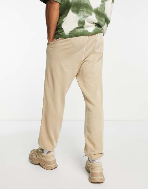 Champion small logo tapered sweatpants in tan