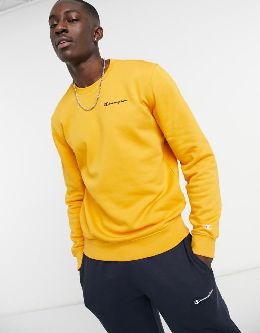 Champion small script chest logo sweatshirts in orange ASOS