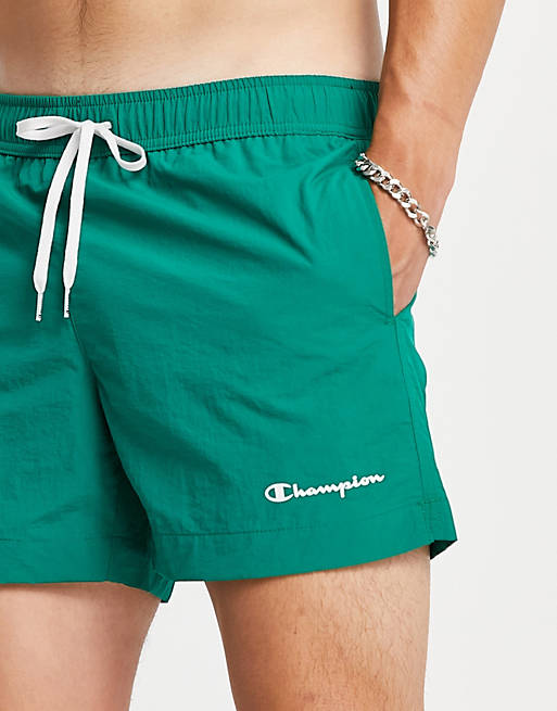 Men Champion small script logo beach shorts in green 