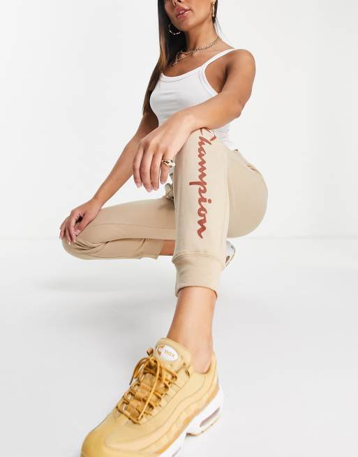 Champion sweatpants with large logo in tan