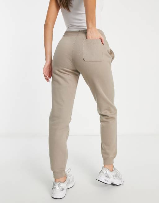 Champion sweatpants with logo in tan