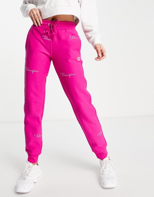 Champion sweatpants with repeat logo in pink ASOS