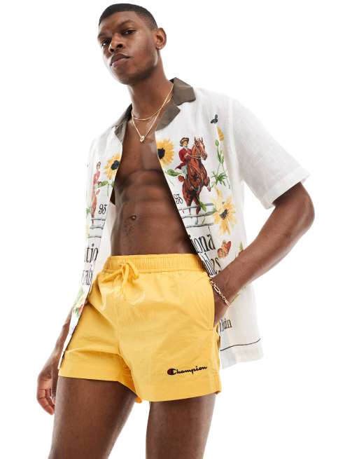 Bershka super skinny acid wash jeans in blue Champion swim shorts in yellow ClassicfuncenterShops