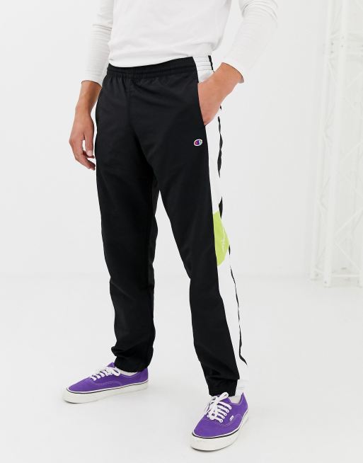 Champion track joggers with side stripe in black | ASOS