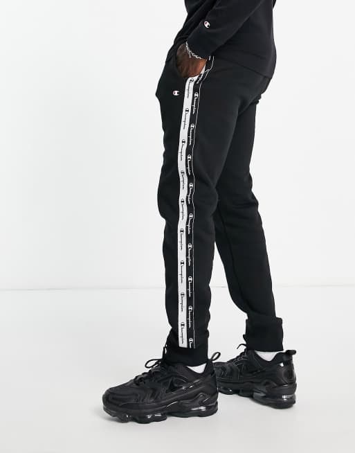 Champion trackies with taping in black | ASOS