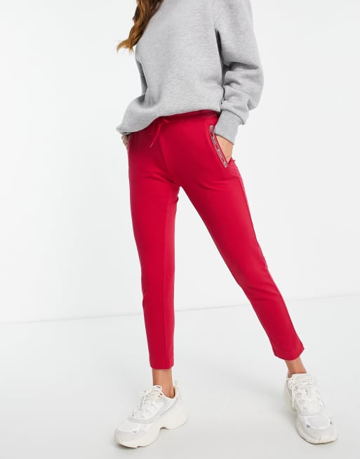 Champion velour jogging bottoms in red ASOS