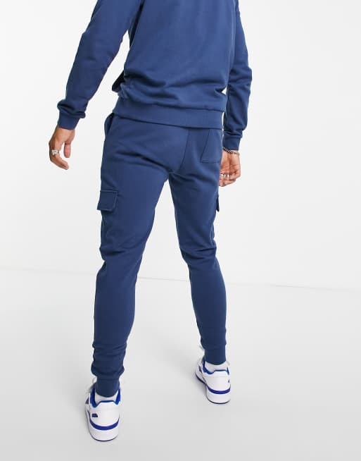 Ch ndal azul oscuro de sudadera con capucha y joggers cargo de corte pitillo de ASOS DESIGN