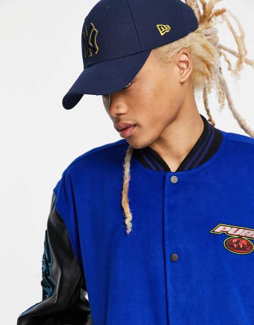Chaqueta bomber azul extragrande de estilo universitario con parches de tejido efecto lana de ASOS DESIGN, 3 de 4