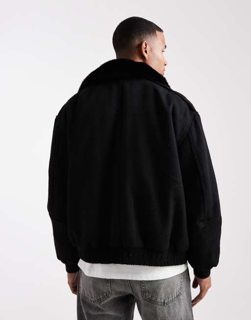 Chaqueta bomber negra de cuero sintético con solapas de tejido efecto lana de ASOS DESIGN, 3 de 5