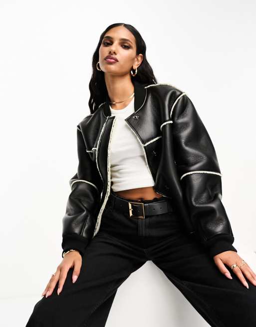 Chaqueta bomber negra y color crema con ribetes de borreguito de ASOS DESIGN
