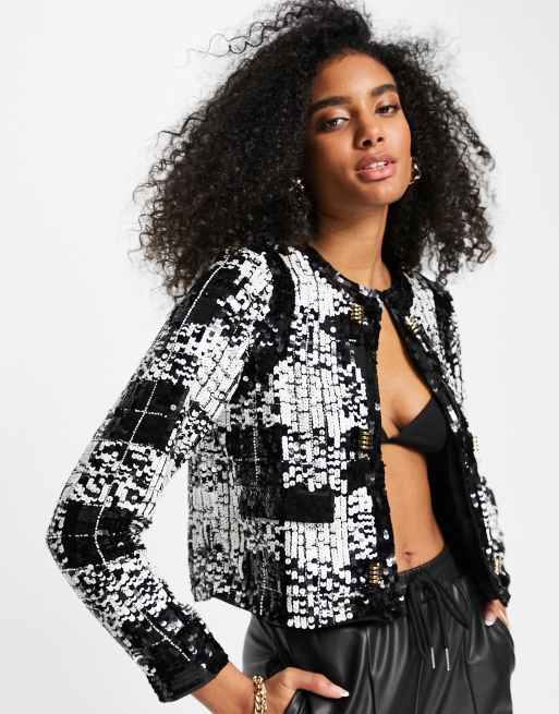 Chaqueta corta a cuadros negros de bouclé y lentejuelas de River Island