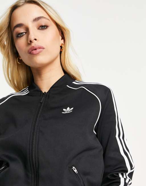 cooperar Registro Síguenos Chaqueta de chándal negra con cuello alto con cremallera y logo de tres  rayas adicolor de adidas Originals | ASOS