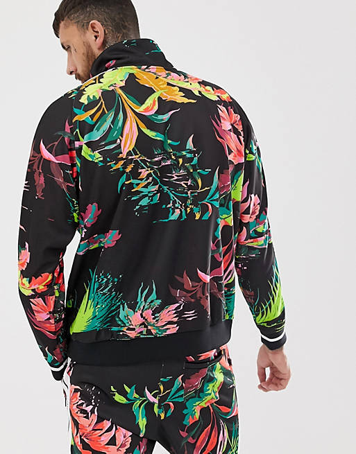grosor Coordinar Cabecear Chaqueta de chándal negra con estampado floral de Nike | ASOS