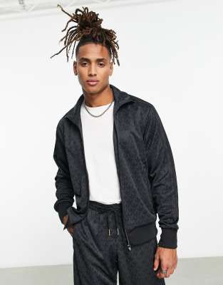 Chaqueta de chándal negra con monograma de trébol de adidas Originas | ASOS
