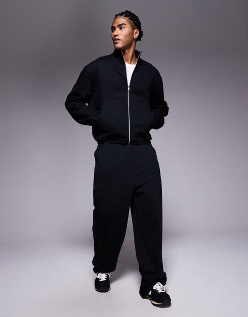 Chaqueta de chándal negra holgada con cremallera de punto liso de ASOS DESIGN, 2 de 5