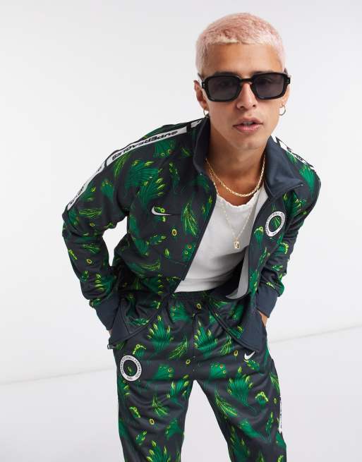 Sano Teoría de la relatividad Mona Lisa Chaqueta de chándal verde con estampado de Nigeria Anthem de Nike Football  | ASOS