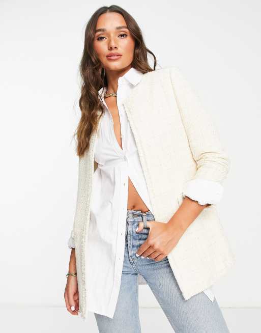 Chaqueta larga color crema de tweed de Mango