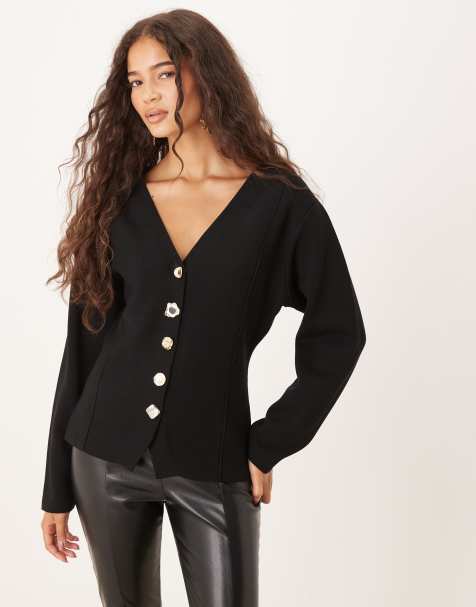 Chaqueta negra con botones llamativos de punto compacto de Mango - view 1