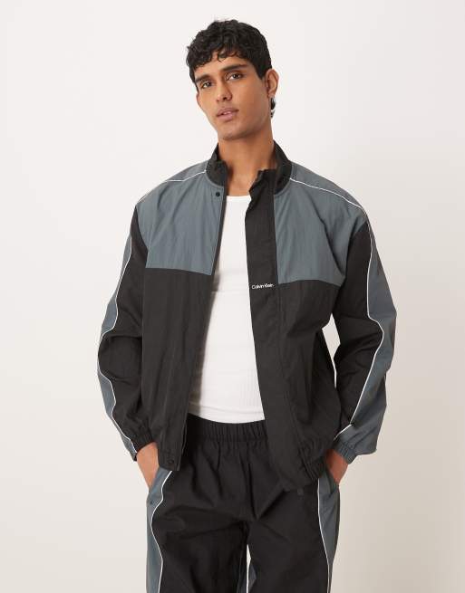 Chaqueta negra y gris con diseño color block de Calvin Klein Performance (parte de un conjunto)