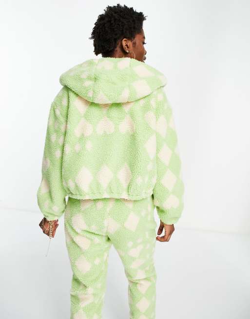 Chaqueta polar color menta con capucha, cremallera y estampado de