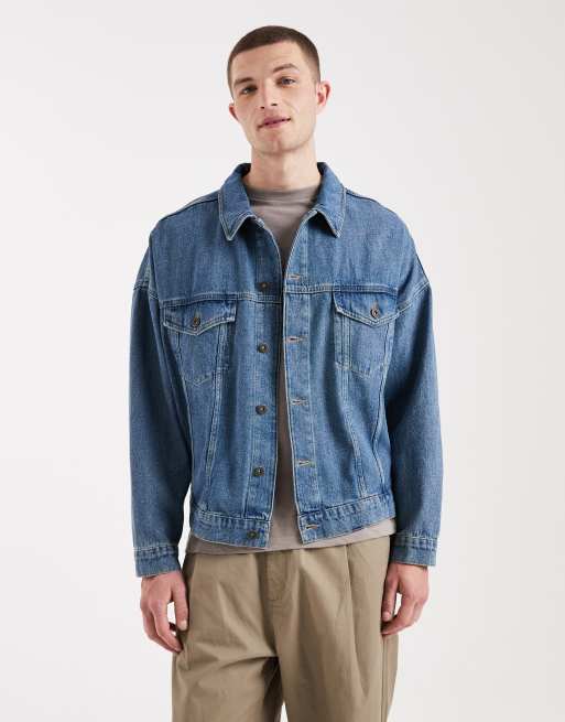 Chaqueta vaquera azul medio lavado estilo camionero extragrande de ASOS DESIGN, 4 de 5