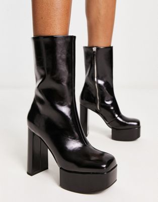 Charles and Keith heeled platform boots in black | ASOS
