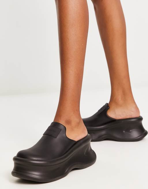 Charles & Keith backless rubber shoes in black |