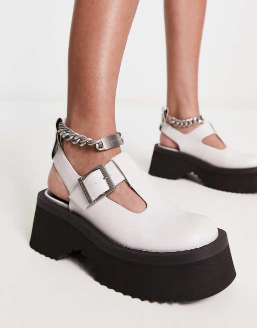 Charles & Keith – Białe buty na masywnej podeszwie z zapięciem typu T-bar i paskiem za piętą
