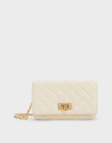 Charles & Keith Cressida quilted push-lock clutch in cream - view 1