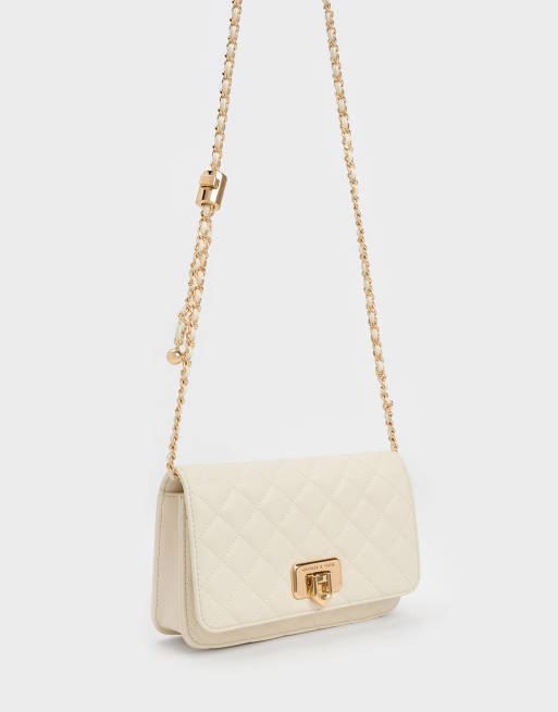 Charles & Keith Cressida quilted push-lock clutch in cream, 2 of 4