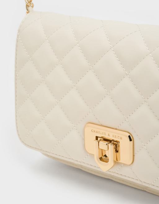 Charles & Keith Cressida quilted push-lock clutch in cream, 3 of 4