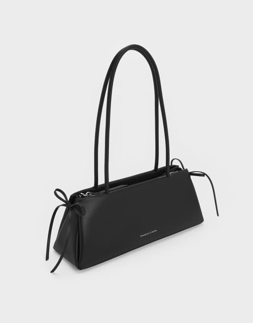 Charles & Keith Hazel bow elongated trapeze shoulder bag in noir, 2 of 4